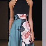 Éléa | Robe longue évasée sans manches à imprimé floral et fente subtile