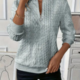 Amandine | Pull en tricot à motifs en relief et col zippé